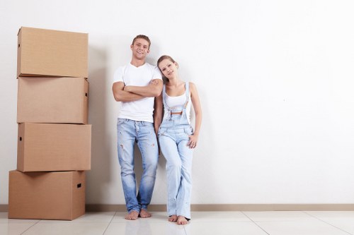 Professional packing and unpacking services in Muswellhill with labeled moving boxes