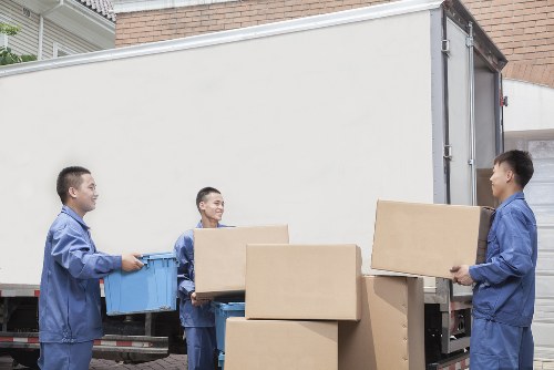 Packed office equipment prepared for commercial moves in Muswellhill