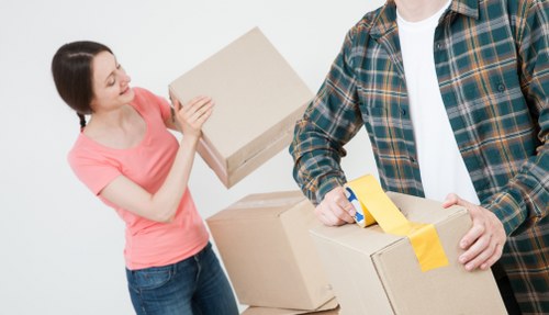 Loading furniture into a moving van in Muswellhill