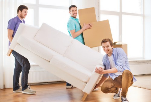 Professional movers handling furniture in Muswell Hill
