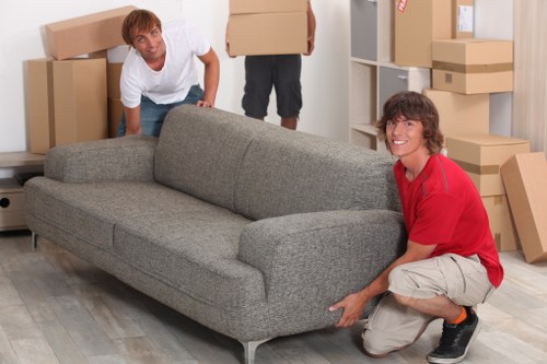 Packed office boxes and labeled furniture ready for removal